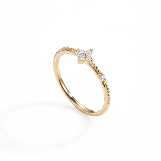 Gold-colored mini four-leaf clover ring